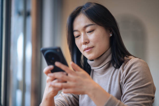 istock asian businesswoman using mobile phone in office 2188965313