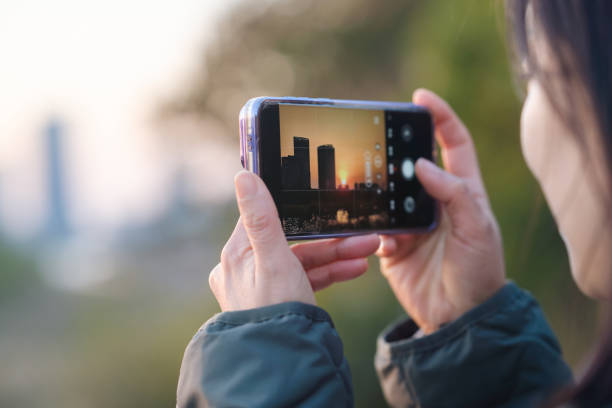 istock asian female using smart phone to take photo 2188965527
