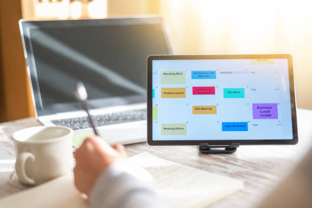 istock Business Person Planning Calendar Appointments And Scheduling Client Meetings Using Digital Tablet In Office. Successful Entrepreneur Organizing Their Professional Agenda. 2188966364