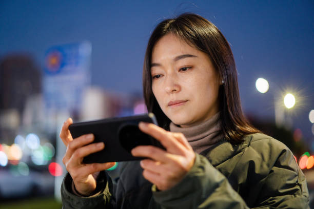 istock asian female using smart phone at night 2188966542