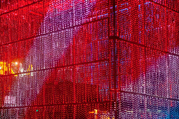 Full frame close-up view of  city street decorations. Rows of LED multi colored light spots. Illumination, building exterior. Vigo, Pontevedra province, Galicia, Spain.