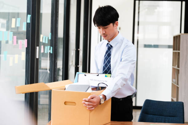istock Employee packing belongings into a box during a job change or resignation 2188967255