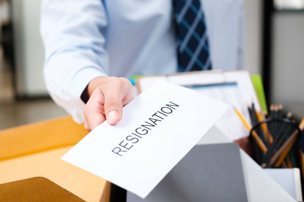 istock Employee handing in a resignation letter during a workplace transition. 2188967320