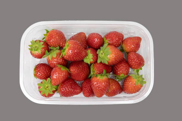 istock Ripe strawberries in an open plastic box. View from above. The box isolated on white background. 2188967524