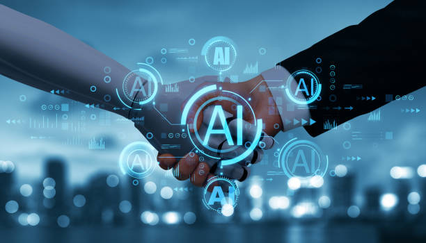 istock AI partnership concept with handshake overlayed by technology symbols and holographic AI icons on modern cityscape background. 2188968497