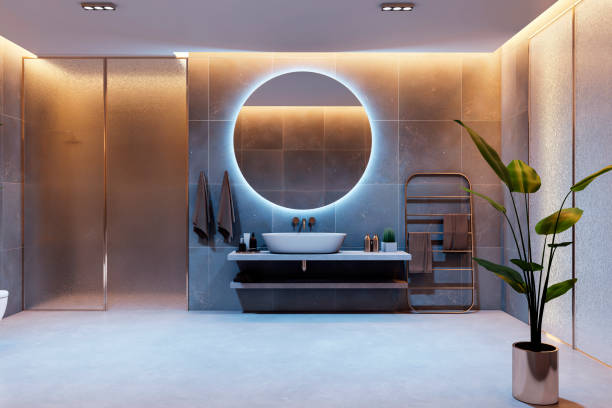 istock Modern spacious bathroom with glowing round mirror, sleek sink, large plant, and elegant lighting arrangement at evening time. 3D Rendering 2188968833