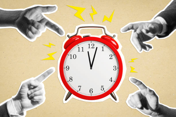 istock Red alarm clock surrounded by pointing hands on beige background, symbolizing urgency and time management in business. 2188969282