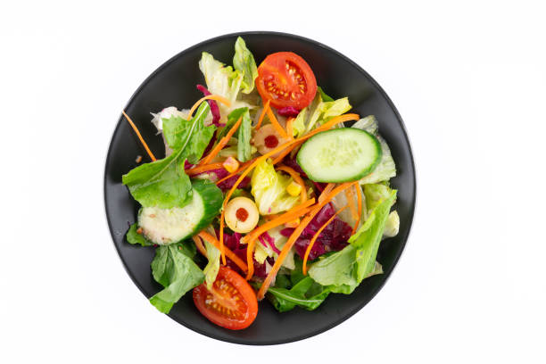 Fresh salad prepared for healthy eating on white background