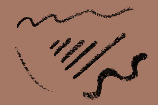 Hand drawn line of black eyeliner on background in mocha mousse color. Macro photo. isolated