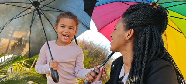 istock It looks like it's going to rain. Joy Under Colorful Umbrellas. 2188971970