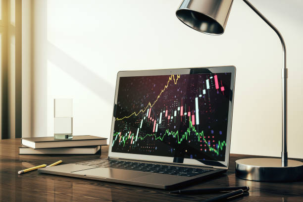 istock Abstract creative financial graph on modern laptop screen, forex and investment concept. 3D Rendering 2188972248