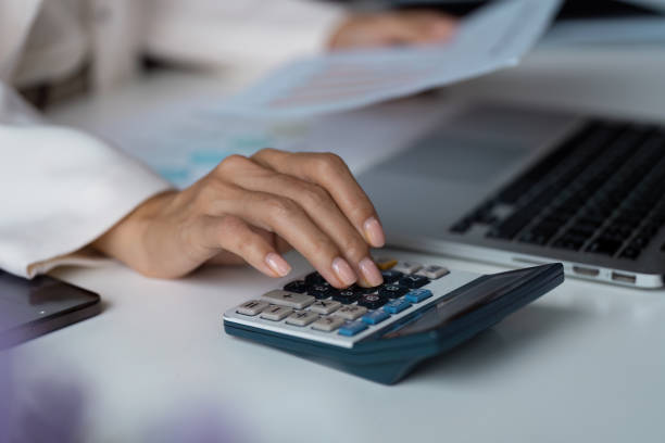 istock Professional Business Workspace with Laptop, Calculator, and Document for Financial Analysis and Planning 2188974303