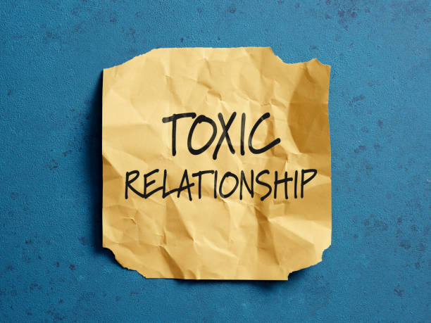 istock Crumpled note showing toxic relationship concept on blue background 2188974664