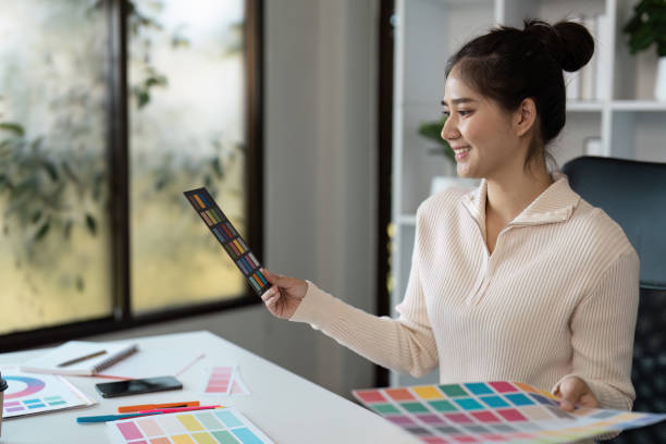 istock Creative Graphic Designer Working with Color Palettes in Modern Office Environment 2188974749