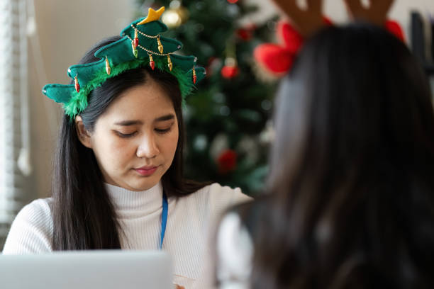 istock Festive Office Environment with Colleagues Celebrating Christmas in a Modern Workspace 2188974794