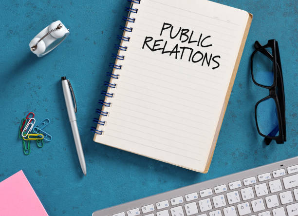 istock Public relations written on notebook lying on blue office desk 2188975293