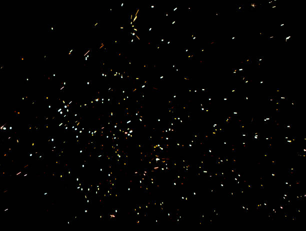 istock A black background with a lot of colorful sparkles 2188975868