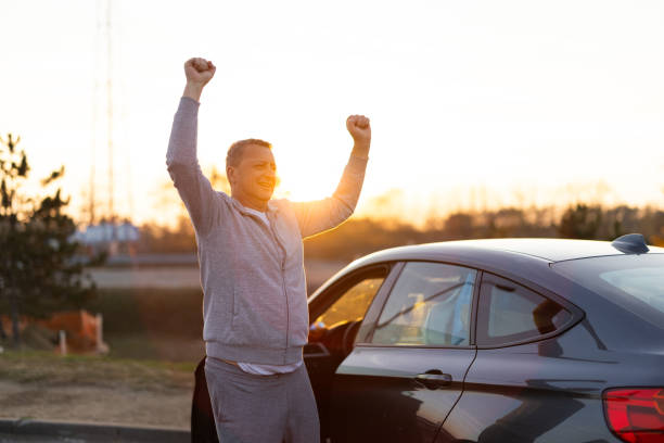 istock Mature man stretching after long drive 2188976824