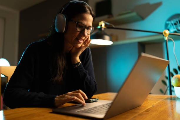 istock Woman working from home in the evening 2188976953