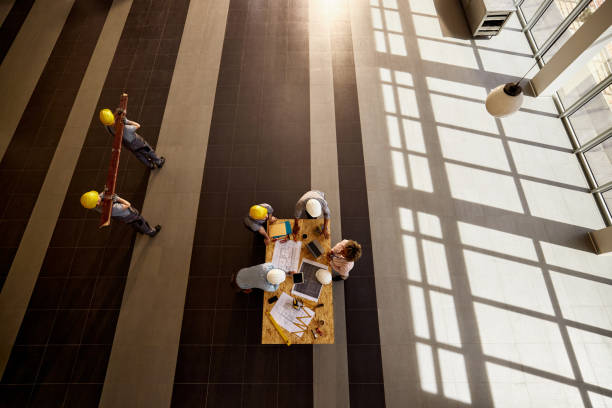 istock Above view of construction team working in the building. 2188977030