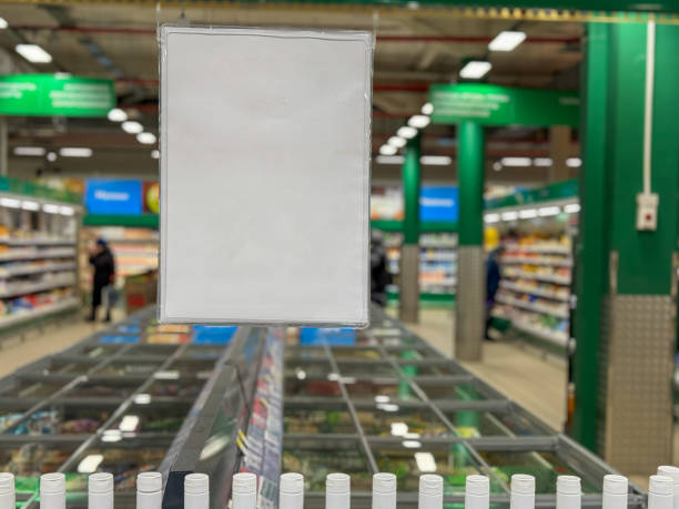 A store with a sign hanging from the ceiling that says No Sale. The store is empty and there are no people in the store