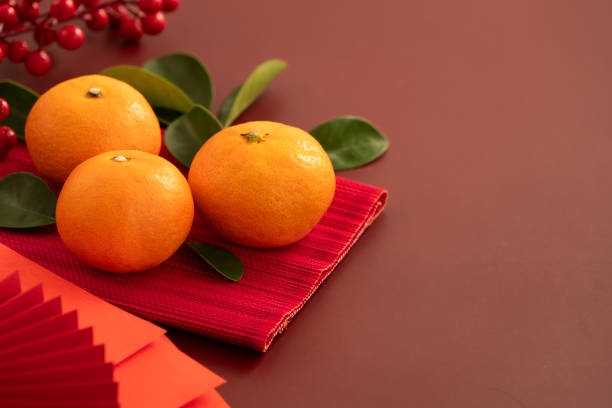 istock Chinese lunar new year background with fresh tangerine and red envelope. 2188977370