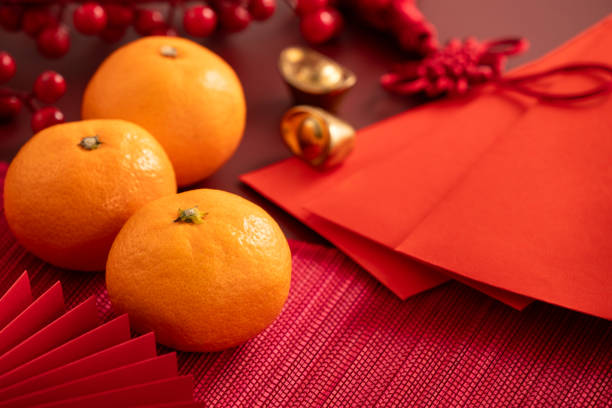 istock Chinese lunar new year background with fresh tangerine and red envelope. 2188977445