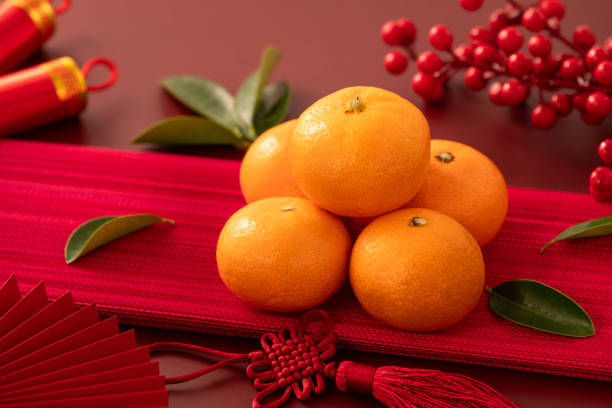 istock Chinese lunar new year background with fresh tangerine and red envelope. 2188977449
