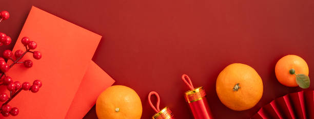 istock Chinese lunar new year background with fresh tangerine and red envelope. 2188977526