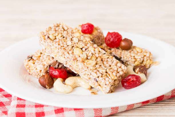 istock Various granola bars on table background. Cereal granola bars. Superfood breakfast bars with oats, nuts and berries, close up. Superfood concept 2188978765