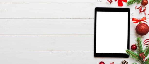 istock Digital tablet mock up with rustic Christmas decorations for app presentation top view with empty space for you design. Christmas online shopping concept. Tablet with copy space on colored background 2188978770