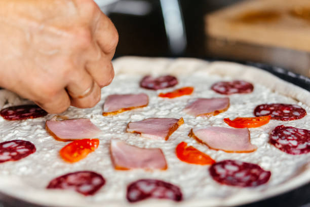 Making cooking pizza fresh ingredients homemade. High quality photo