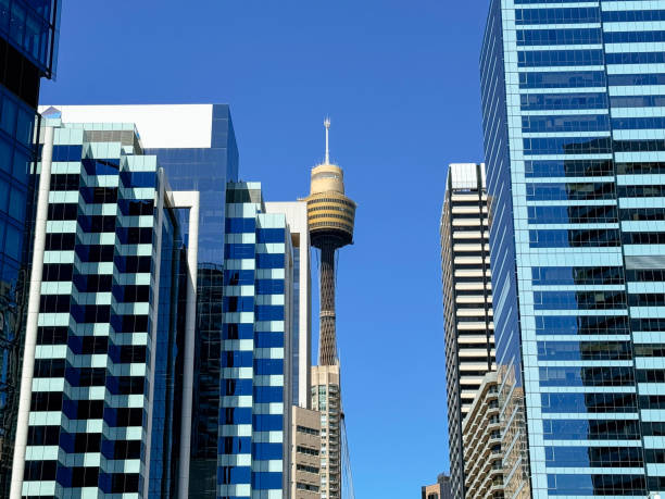 istock Skyline view featuring the iconic Sydney Tower surrounded by modern glass buildings on a clear blue day 2188979158
