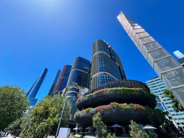 Skyline view featuring  modern glass buildings on a clear blue day in Darling Harbour