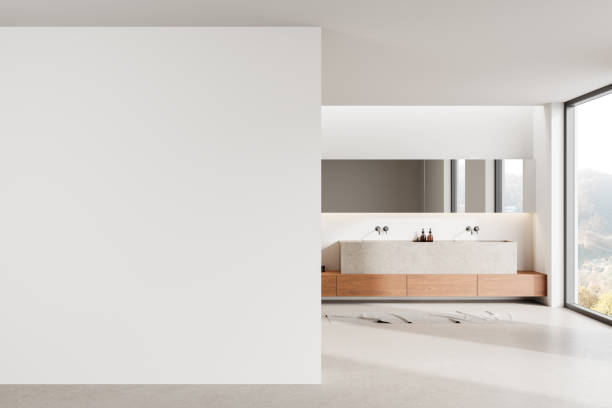 istock White hotel bathroom interior with double sink and accessories, window 2188979962