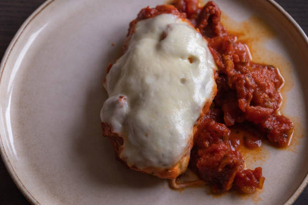 istock Caprese Chicken – Chicken Breast with Tomato Sauce and Mozzarella Cheese Close-Up 2188980559