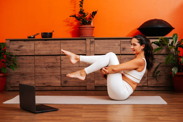 istock Young woman doing workout online 2188982893