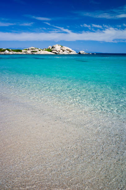 Visiting the Gallura's beaches close to Santa Teresa Gallura is a mesmerizing experience. The waters are crystal clear and colorful. Here we are in Valle dell'Erica beach. Some dominating great boulders gird the beach.