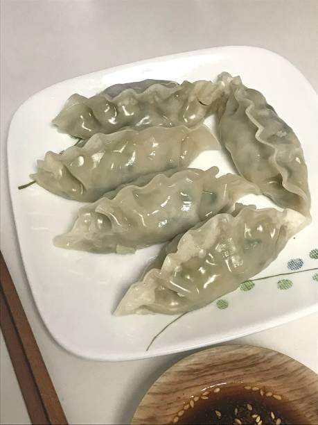 Steamed or fried Korean mandu dumplings filled with a savory mix of meat and vegetables. Crispy on the outside, tender on the inside—perfect for dipping in soy sauce or chili oil!
