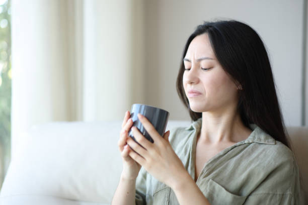 istock Disgusted asian woman drinking coffee 2188984445