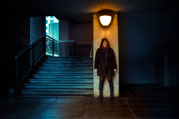 Young homeless man in a subway tunnel.