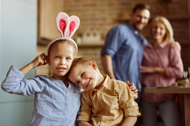 istock Happy embraced brother and sister celebrating Easter at home. 2188986164