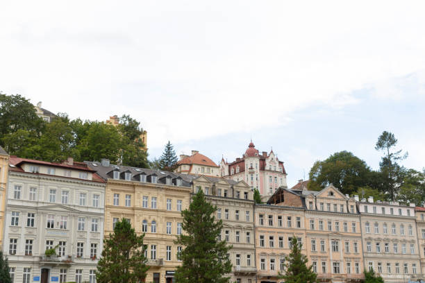 istock A row of buildings with trees in front of them 2188986206