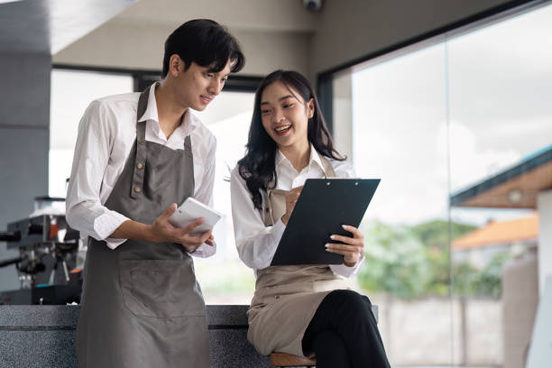 istock Young Professionals collaboration in a Modern Office Environment with Digital Devices and Documents 2188986219
