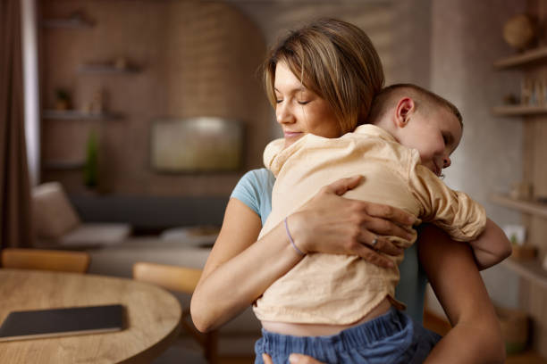 istock Loving mother enjoying with her son at home. 2188986665