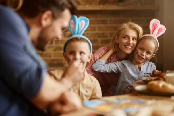 istock Carefree family enjoying during Easter in dining room. 2188986694