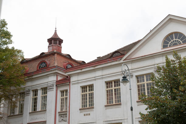 istock A very large white building that features a striking red roof 2188987273