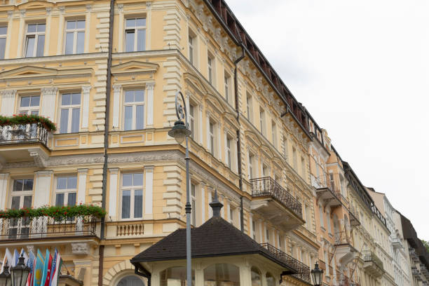 istock There is a large building situated behind a smaller building in front of it 2188987944