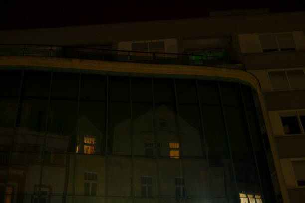 istock A tall building featuring numerous windows is brightly lit up at night 2188988539