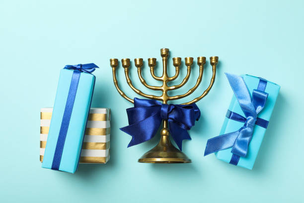 istock Gift boxes and hanukkiah on blue background, top view 2188989966